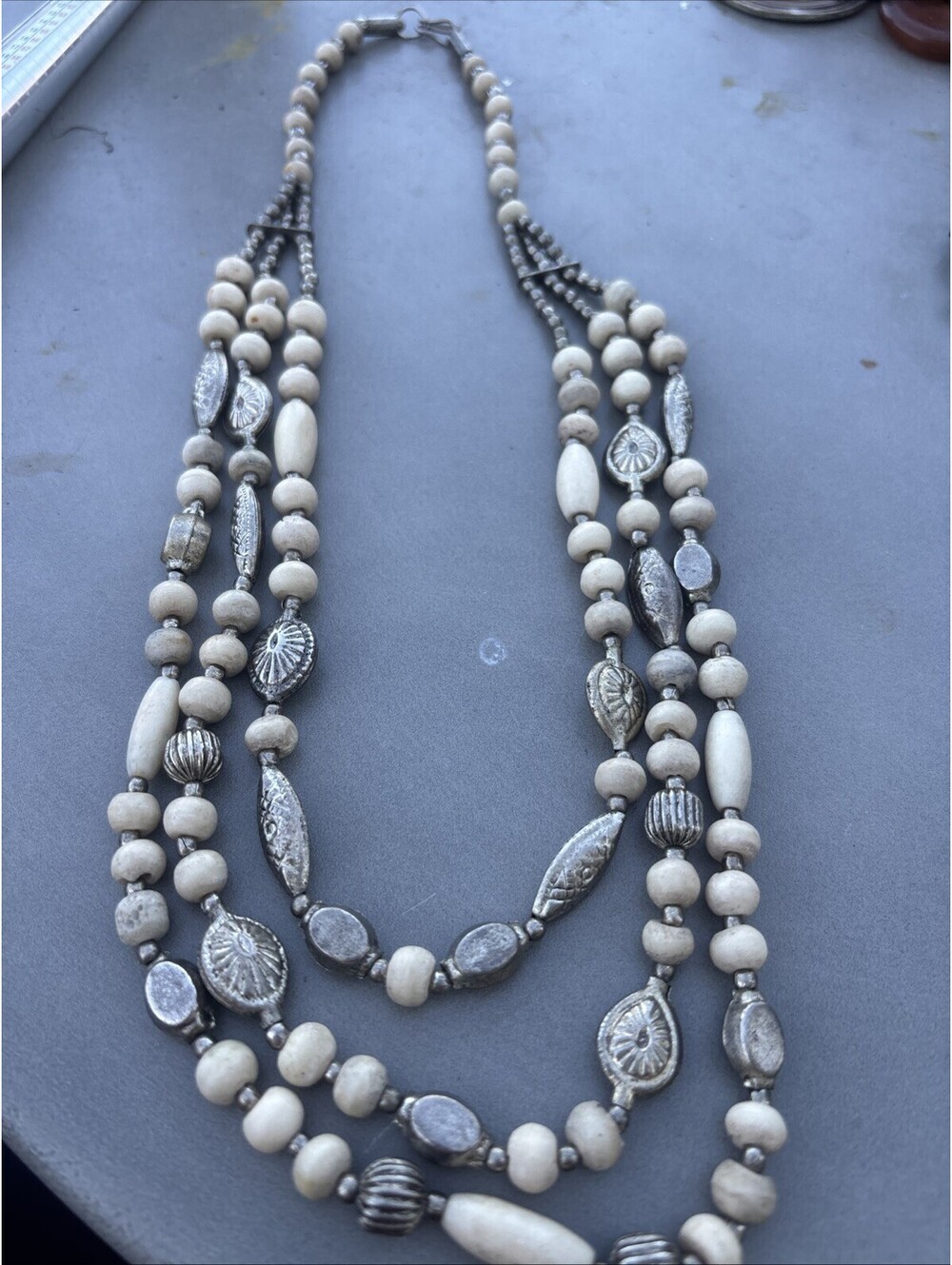 vintage triple strand necklace off white Cream carved and silver tone beads